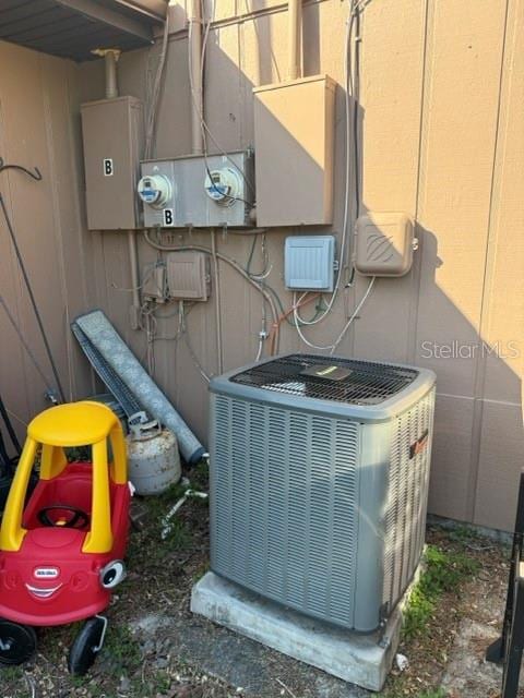 details with central air condition unit and electric meter