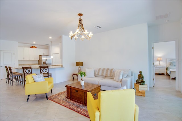 tiled living room with a chandelier