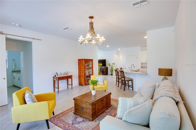 tiled living room featuring an inviting chandelier and sink