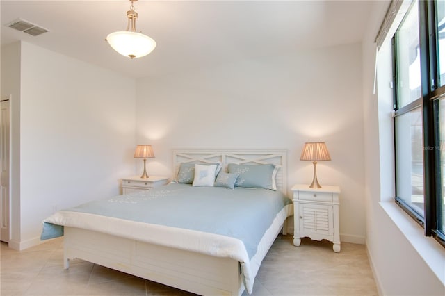 bedroom featuring light tile patterned floors