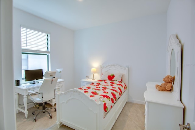 bedroom featuring light tile patterned flooring