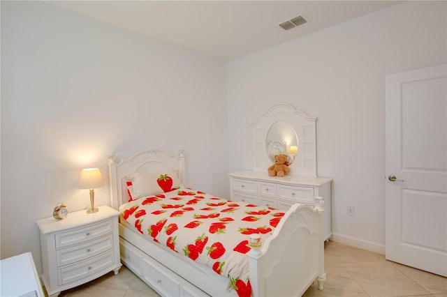 bedroom with light tile patterned flooring