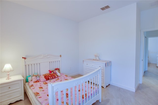 bedroom featuring light tile patterned floors