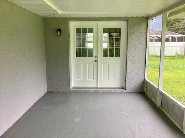 doorway to property with stucco siding