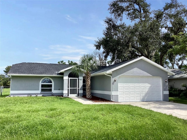 ranch-style home with stucco siding, a garage, a front yard, and driveway
