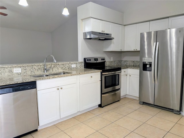 kitchen with stainless steel appliances, a sink, under cabinet range hood, and light stone counters