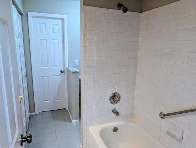 full bath with tile patterned flooring, shower / bathtub combination, and baseboards