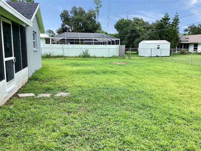view of yard with a storage unit and an outbuilding