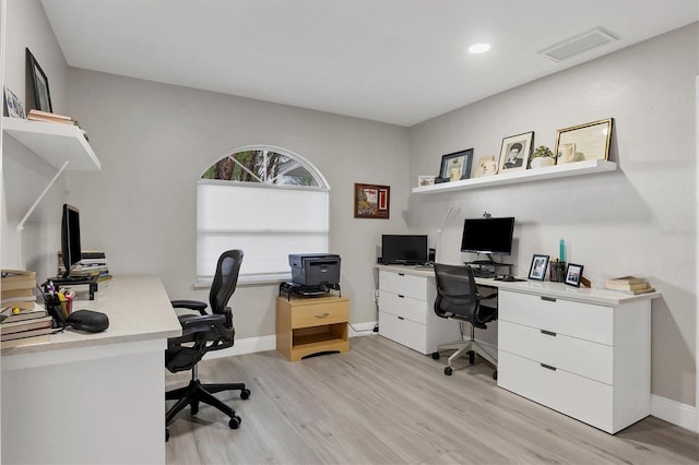 office space with light hardwood / wood-style flooring