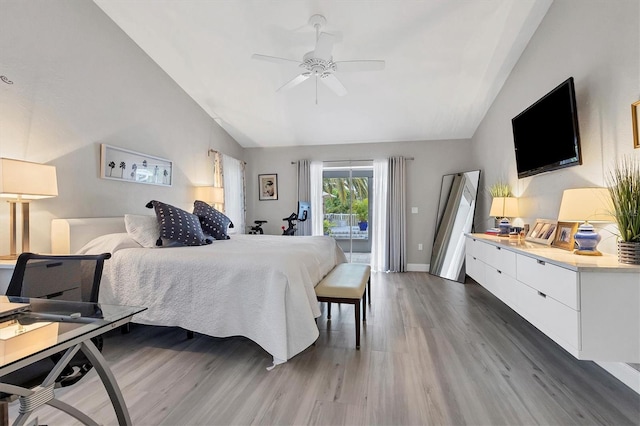 bedroom with lofted ceiling, access to outside, dark hardwood / wood-style floors, and ceiling fan