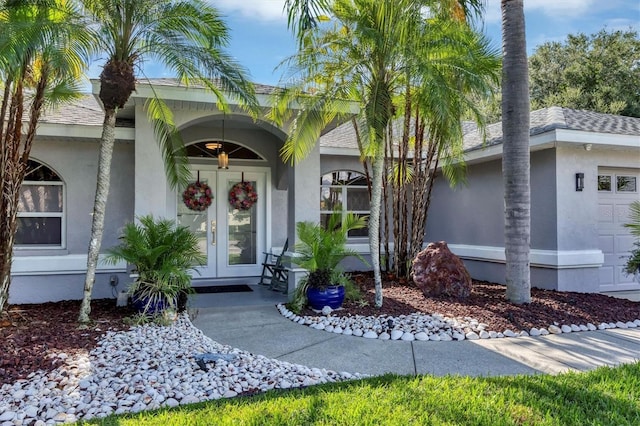 property entrance with french doors and a garage