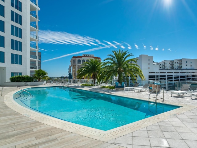 view of swimming pool with a patio