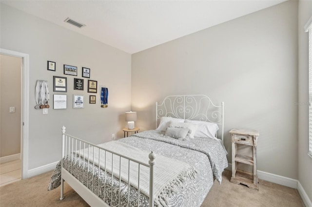 bedroom with light carpet