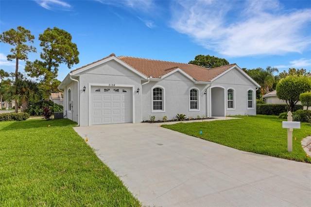 view of front of property featuring a front yard and a garage