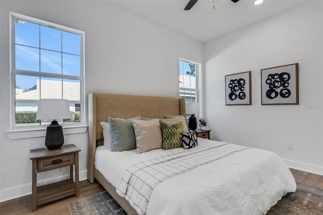 bedroom with hardwood / wood-style floors and ceiling fan