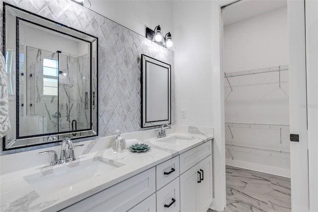 bathroom featuring vanity and a shower with door