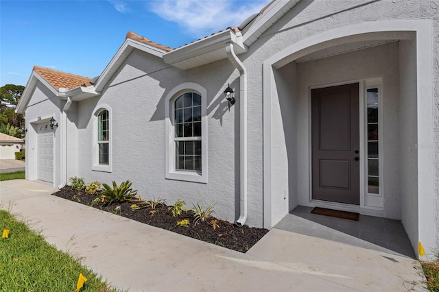 property entrance featuring a garage