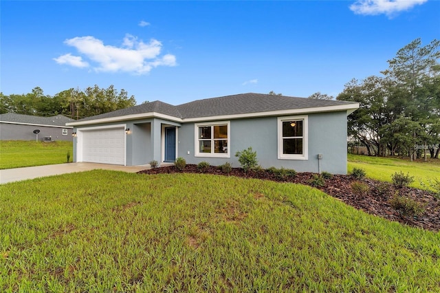 ranch-style home featuring a garage and a front yard