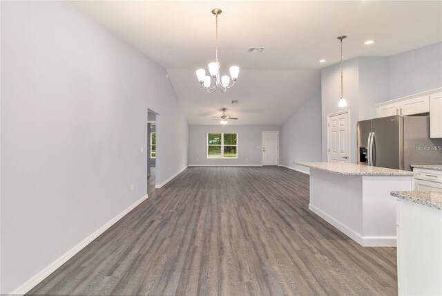 kitchen with white cabinets, ceiling fan with notable chandelier, dark hardwood / wood-style flooring, decorative light fixtures, and stainless steel refrigerator with ice dispenser