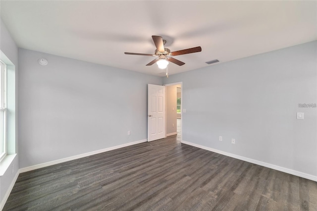 6319 NW 67th Ter, Ocala, FL 34482 - empty room with ceiling fan, dark wood-style flooring, baseboards, and a smoke detector