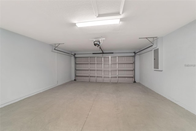 6319 NW 67th Ter, Ocala, FL 34482 - garage with electric panel and a garage door opener