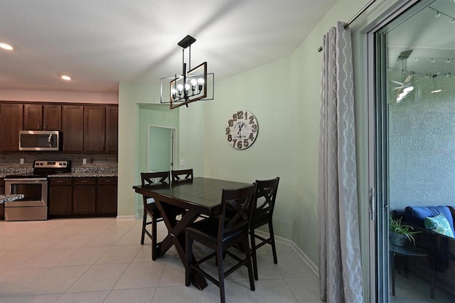 dining room with a chandelier, baseboards, recessed lighting, and light tile patterned floors