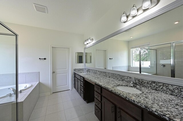 bathroom with separate shower and tub, tile patterned flooring, and vanity