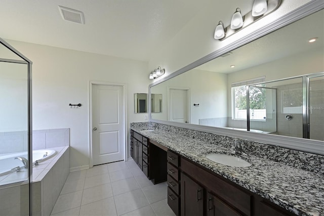 full bath with a shower stall, tile patterned flooring, double vanity, a sink, and a bath