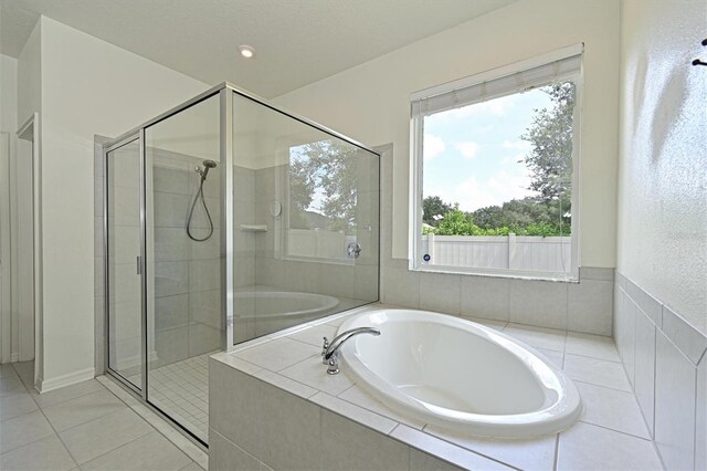 bathroom with plus walk in shower and tile patterned floors