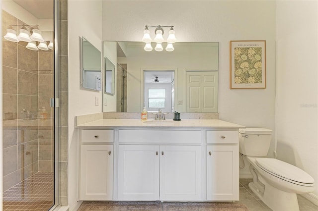 bathroom featuring vanity, toilet, tile patterned floors, and a shower with door