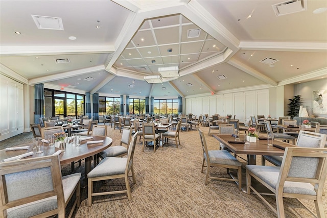 carpeted dining space with beamed ceiling and high vaulted ceiling