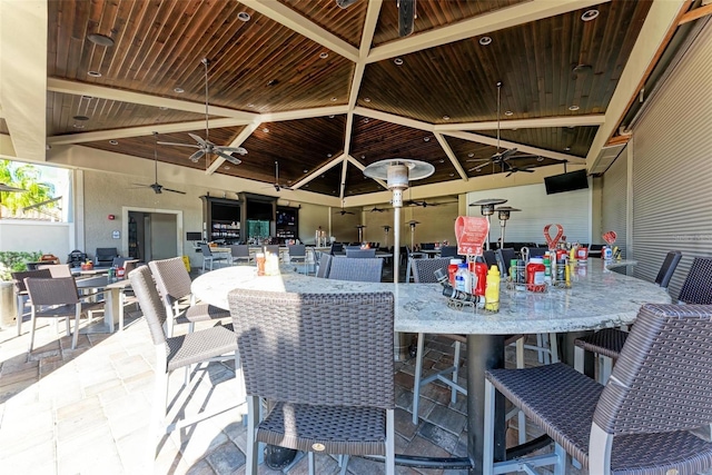view of patio / terrace with outdoor dining area and a ceiling fan