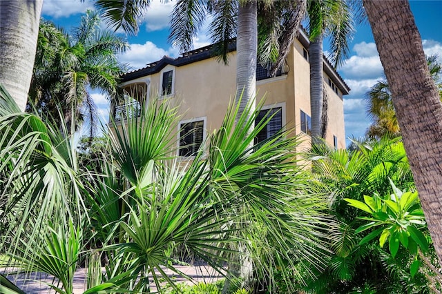 view of side of property with a balcony