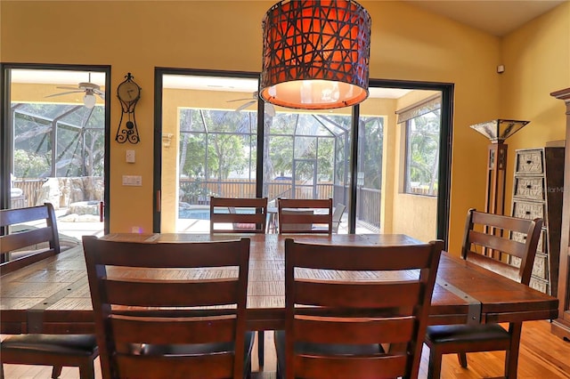 dining space featuring ceiling fan, light wood-type flooring, and a wealth of natural light