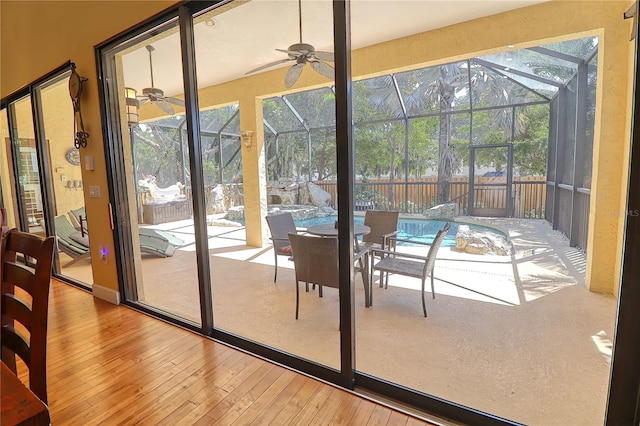 entryway with ceiling fan and light wood-type flooring