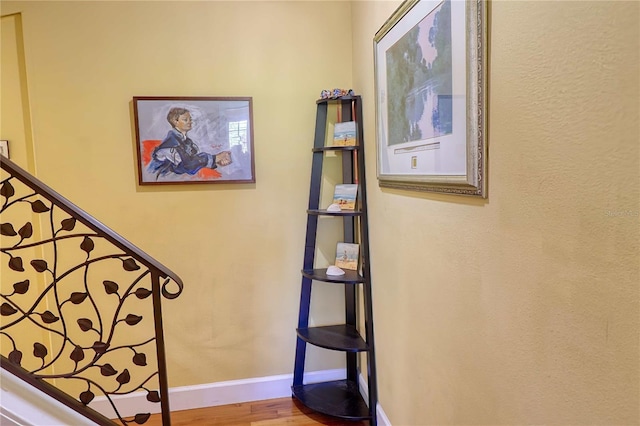 stairway featuring hardwood / wood-style floors