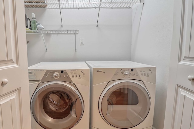 laundry area with washer and dryer