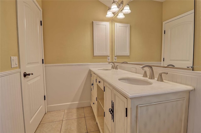 bathroom with tile patterned flooring and vanity