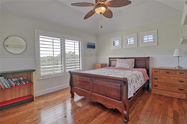 bedroom with wood-type flooring and ceiling fan