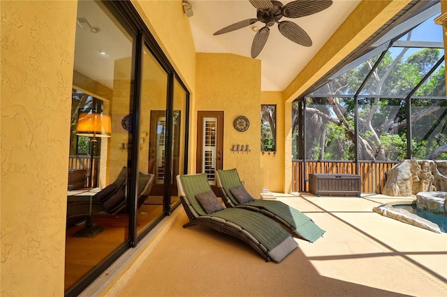 sunroom / solarium featuring ceiling fan