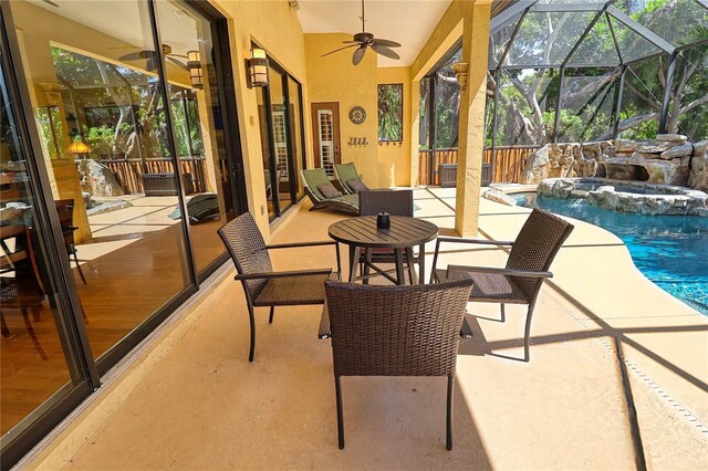 exterior space featuring a wealth of natural light and ceiling fan