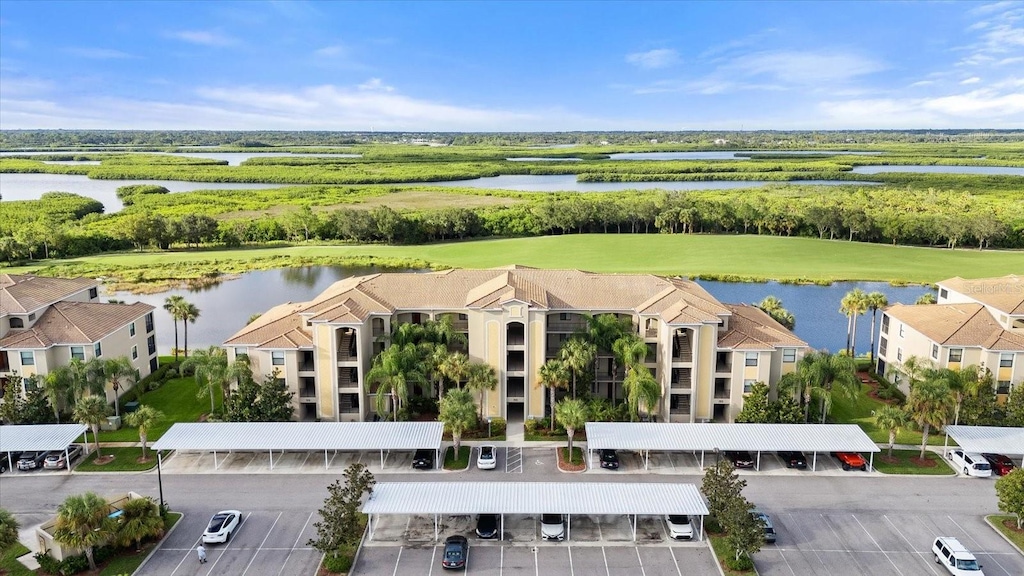 birds eye view of property with a water view