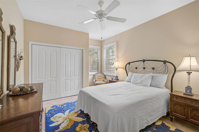 bedroom featuring ceiling fan and a closet