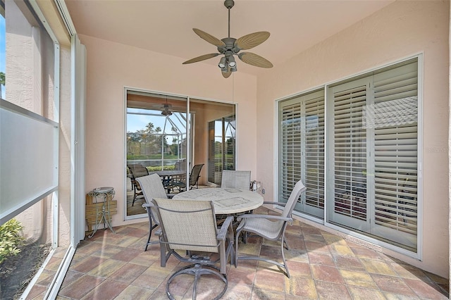 sunroom with ceiling fan