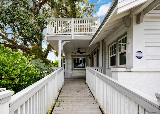 exterior space with ceiling fan