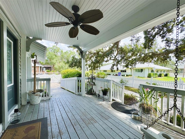 wooden terrace featuring ceiling fan