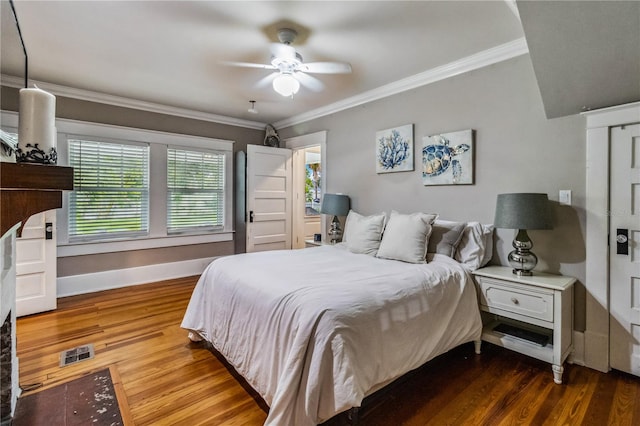 bedroom featuring ceiling fan, hardwood / wood-style flooring, and ornamental molding