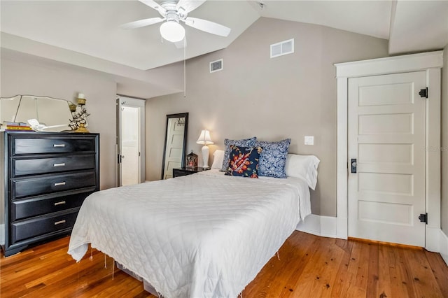 bedroom featuring lofted ceiling, ceiling fan, and hardwood / wood-style floors