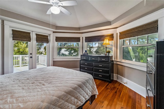 bedroom featuring multiple windows, access to outside, and ceiling fan