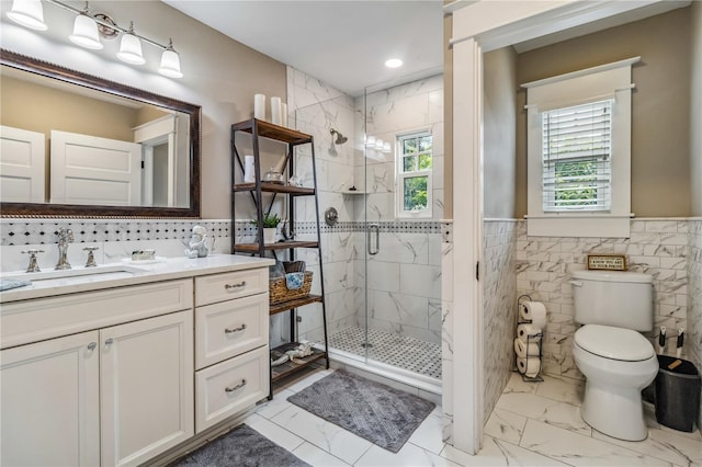 bathroom with walk in shower, tile walls, vanity, and toilet